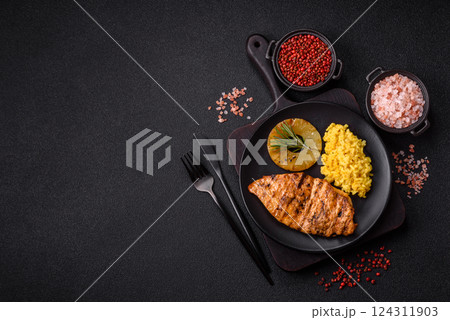 Delicious fresh grilled chicken fillet with spices and herbs 124311903