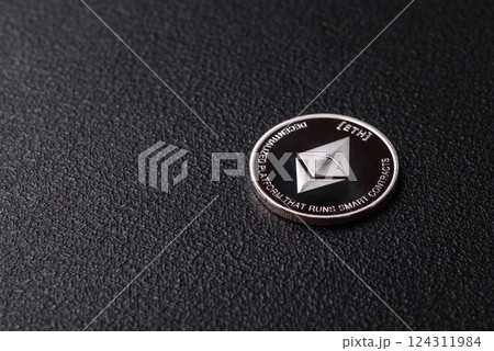 Ethereum cryptocurrency dummy in the form of a round iron coin Ethereum cryptocurrency dummy in the form of a round iron coin 124311984
