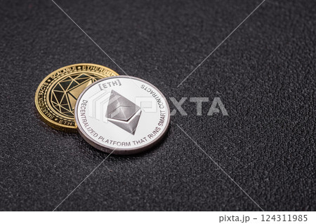 Ethereum cryptocurrency dummy in the form of a round iron coin 124311985