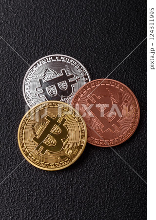 Bitcoin cryptocurrency dummy in the form of a round iron coin Bitcoin cryptocurrency dummy in the form of a round iron coin 124311995