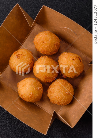 Crispy French fries with mozzarella cheese with raspberry sauce 124312077