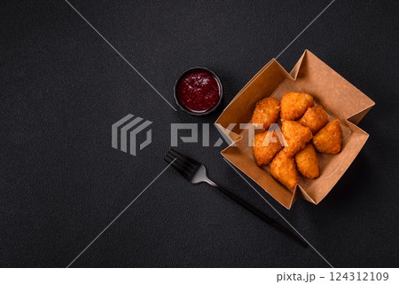 Brie cheese or camembert fries in breading, fast food, takeaway 124312109