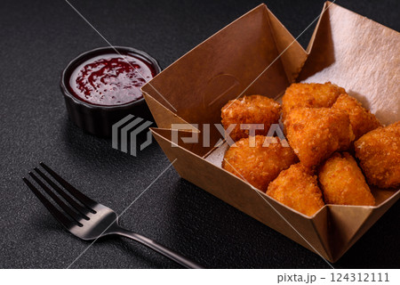 Brie cheese or camembert fries in breading, fast food, takeaway Brie cheese or camembert fries in breading, fast food, takeaway 124312111