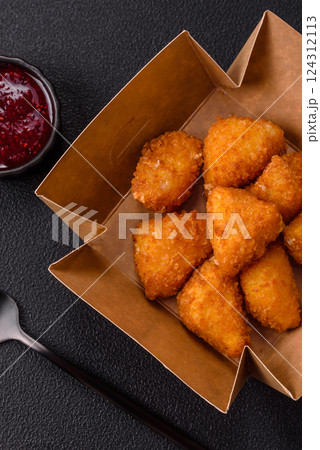 Brie cheese or camembert fries in breading, fast food, takeaway Brie cheese or camembert fries in breading, fast food, takeaway 124312113