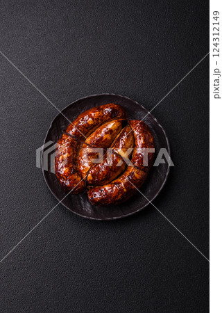 Delicious sausage with salt, spices and herbs Delicious sausage with salt, spices and herbs 124312149