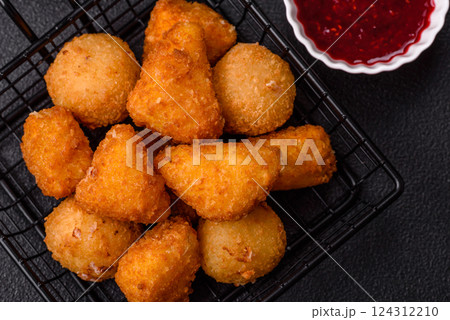 Brie cheese or camembert fries in breading, fast food, takeaway 124312210