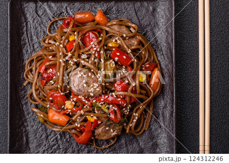 Delicious spicy Asian food soba with buckwheat noodles, beef, vegetables 124312246
