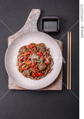 Delicious spicy Asian food soba with buckwheat noodles, beef, vegetables 124312275