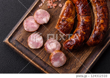 Delicious sausage with salt, spices and herbs 124312310