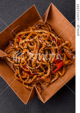 Delicious Asian food udon with noodles, chicken, hot pepper, vegetables Delicious Asian food udon with noodles, chicken, hot pepper, vegetables 124312345