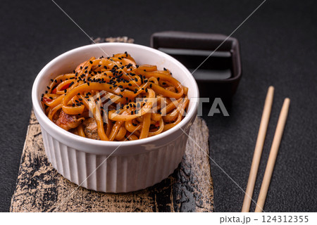 Delicious Asian food udon with noodles, chicken, hot pepper, vegetables Delicious Asian food udon with noodles, chicken, hot pepper, vegetables 124312355