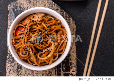 Delicious Asian food udon with noodles, chicken, hot pepper, vegetables Delicious Asian food udon with noodles, chicken, hot pepper, vegetables 124312356