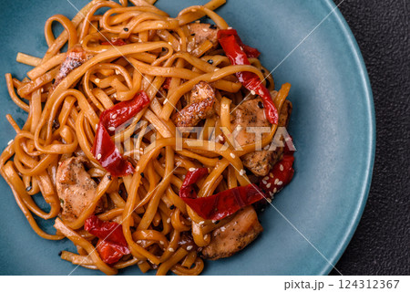 Delicious Asian food udon with noodles, chicken, hot pepper, vegetables Delicious Asian food udon with noodles, chicken, hot pepper, vegetables 124312367