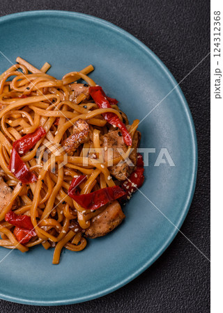 Delicious Asian food udon with noodles, chicken, hot pepper, vegetables Delicious Asian food udon with noodles, chicken, hot pepper, vegetables 124312368