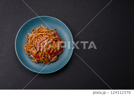 Delicious Asian food udon with noodles, chicken, hot pepper, vegetables Delicious Asian food udon with noodles, chicken, hot pepper, vegetables 124312370