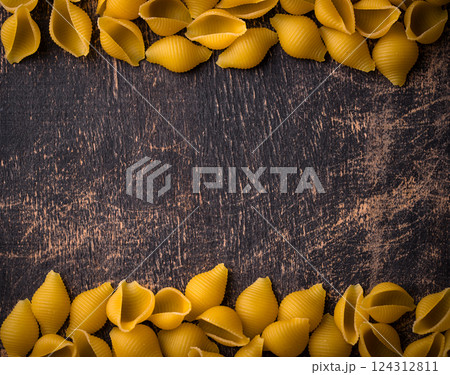Raw pasta in shape of shells 124312811