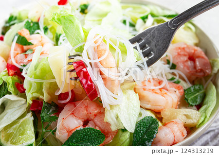 Thai salad with shrimp and rice noodles, pineapple slices, coriander and mint leaves, homemade , no people, 124313219