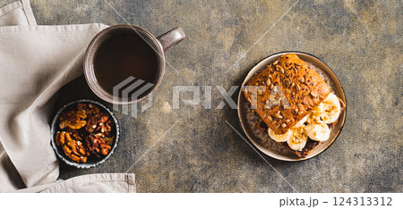 Toast rye bread with chocolate and banana on a plate on the table top view web banner Toast rye bread with chocolate and banana on a plate on the table top view web banner 124313312
