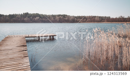 Landscape with a lake on a sunny day, color toning applied. Landscape with a lake on a sunny day, color toning applied. 124313569