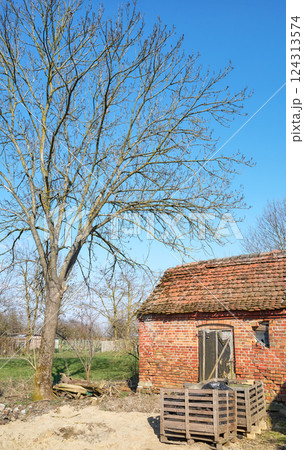 Old abandoned red brick building in the countryside. Old abandoned red brick building in the countryside. 124313574
