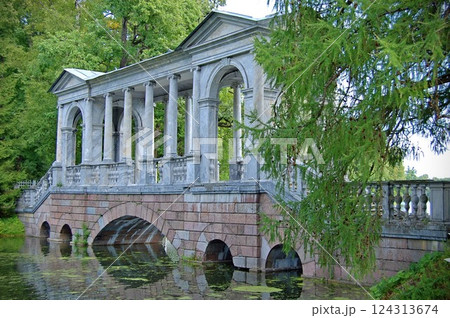 Marble Bridge Over Water in a Lush Park 124313674