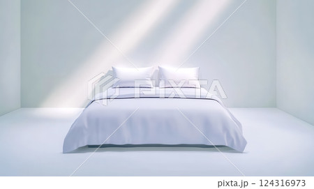 White bed in minimalist room with sunlight streaming in 124316973