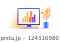 Modern computer displaying colorful bar graph with decorative plant 124316980