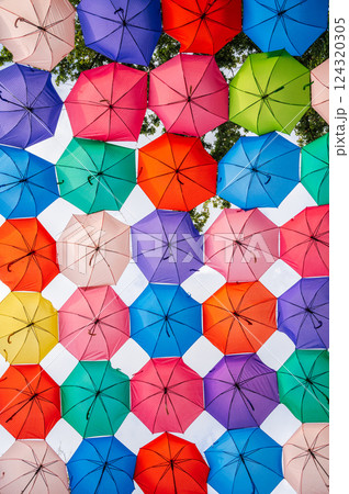 beautiful multicolored colorful umbrellas decoration on festive street on Magic City Park in Tashkent in Uzbekistan 124320305