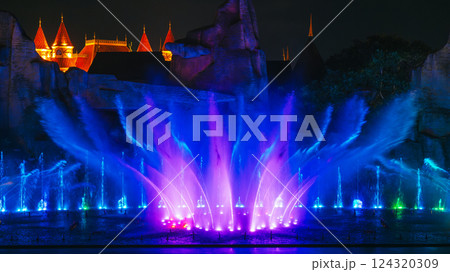 beautiful bright blue illuminated dancing and singing fountains at night. Musical performance show beautiful bright blue illuminated dancing and singing fountains at night. Musical performance show 124320309