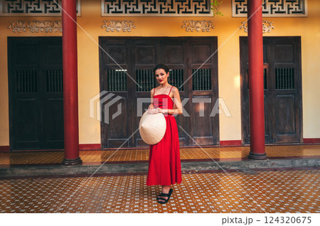 beautiful young tourist woman in Non La hat at Long Son Pagoda in Vietnam in Asia 124320675
