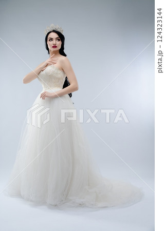 Elegant bride in stunning lingerie-inspired gown with beautiful crown 124323144