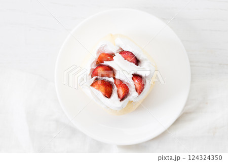 Crepe cake topped with fresh cream and strawberries. Crepe cake topped with fresh cream and strawberries. 124324350