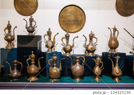 antique traditional Uzbek copper and brass jugs at Museum of Antiques in Tashkent in Uzbekistan 124325130