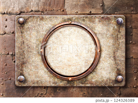 Old metallic plank with rivets and round frame. Vintage metal plate with nails. Can be used for steampunk, retro and vintage design. Mock up template. Copy space for text Old metallic plank with rivets and round frame. Vintage metal plate with nails. Can be used for steampunk, retro and vintage design. Mock up template. Copy space for text 124326389
