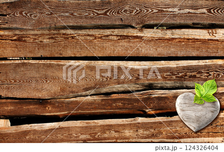 Horizontal banner with wooden heart on boards. Ecology, global wildlife resource, eco, go green, forest protect concept. Environmental and conservation protection background. Copy space for text Horizontal banner with wooden heart on boards. Ecology, global wildlife resource, eco, go green, forest protect concept. Environmental and conservation protection background. Copy space for text 124326404