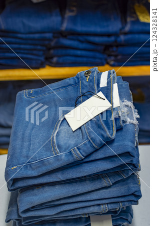 Close up of blue jeans on others with copy space, Various jeans on others with space for text 124328141