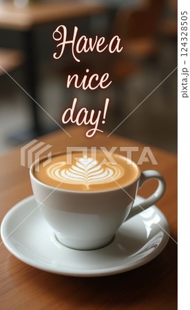 Cup of coffee with foam pattern standing on white saucer on a wooden table. Inscription Have a nice day Cup of coffee with foam pattern standing on white saucer on a wooden table. Inscription Have a nice day 124328505