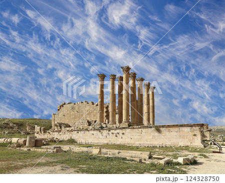 Temple of Zeus, Jordanian city of Jerash  (Gerasa of Antiquity), capital and largest city of Jerash Governorate, Jordan. Against the background of a beautiful sky with clouds 124328750