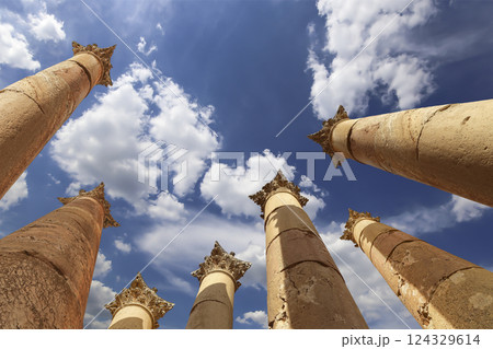 Roman Columns in the Jordanian city of Jerash (Gerasa of Antiquity), capital and largest city of Jerash Governorate, Jordan. Against the background of a beautiful sky with clouds Roman Columns in the Jordanian city of Jerash (Gerasa of Antiquity), capital and largest city of Jerash Governorate, Jordan. Against the background of a beautiful sky with clouds 124329614