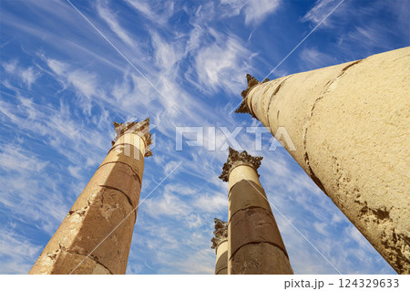 Roman Columns in the Jordanian city of Jerash (Gerasa of Antiquity), capital and largest city of Jerash Governorate, Jordan. Against the background of a beautiful sky with clouds Roman Columns in the Jordanian city of Jerash (Gerasa of Antiquity), capital and largest city of Jerash Governorate, Jordan. Against the background of a beautiful sky with clouds 124329633