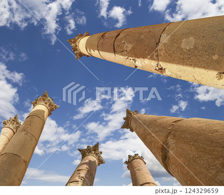 Roman Columns in the Jordanian city of Jerash (Gerasa of Antiquity), capital and largest city of Jerash Governorate, Jordan. Against the background of a beautiful sky with clouds 124329659