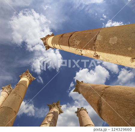 Roman Columns in the Jordanian city of Jerash (Gerasa of Antiquity), capital and largest city of Jerash Governorate, Jordan. Against the background of a beautiful sky with clouds Roman Columns in the Jordanian city of Jerash (Gerasa of Antiquity), capital and largest city of Jerash Governorate, Jordan. Against the background of a beautiful sky with clouds 124329660