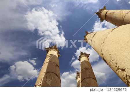 Roman Columns in the Jordanian city of Jerash (Gerasa of Antiquity), capital and largest city of Jerash Governorate, Jordan. Against the background of a beautiful sky with clouds 124329673