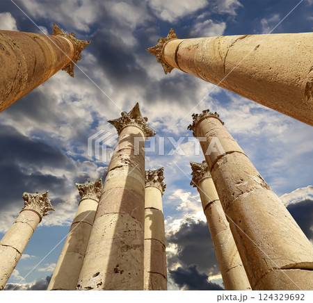 Roman Columns in the Jordanian city of Jerash (Gerasa of Antiquity), capital and largest city of Jerash Governorate, Jordan. Against the background of a beautiful sky with clouds Roman Columns in the Jordanian city of Jerash (Gerasa of Antiquity), capital and largest city of Jerash Governorate, Jordan. Against the background of a beautiful sky with clouds 124329692