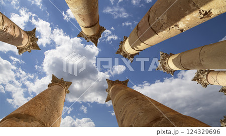 Roman Columns in the Jordanian city of Jerash (Gerasa of Antiquity), capital and largest city of Jerash Governorate, Jordan. Against the background of a beautiful sky with clouds Roman Columns in the Jordanian city of Jerash (Gerasa of Antiquity), capital and largest city of Jerash Governorate, Jordan. Against the background of a beautiful sky with clouds 124329696