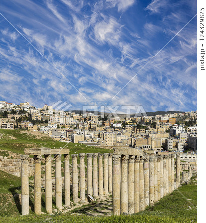 Roman Columns in the Jordanian city of Jerash (Gerasa of Antiquity), capital and largest city of Jerash Governorate, Jordan. Against the background of a beautiful sky with clouds Roman Columns in the Jordanian city of Jerash (Gerasa of Antiquity), capital and largest city of Jerash Governorate, Jordan. Against the background of a beautiful sky with clouds 124329825