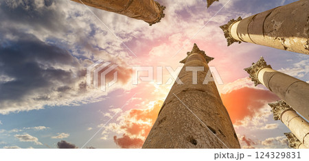 Roman Columns in the Jordanian city of Jerash (Gerasa of Antiquity), capital and largest city of Jerash Governorate, Jordan. Against the background of a beautiful sky with clouds Roman Columns in the Jordanian city of Jerash (Gerasa of Antiquity), capital and largest city of Jerash Governorate, Jordan. Against the background of a beautiful sky with clouds 124329831