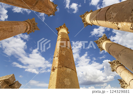 Roman Columns in the Jordanian city of Jerash (Gerasa of Antiquity), capital and largest city of Jerash Governorate, Jordan. Against the background of a beautiful sky with clouds 124329881