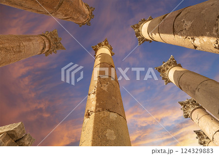 Roman Columns in the Jordanian city of Jerash (Gerasa of Antiquity), capital and largest city of Jerash Governorate, Jordan. Against the background of a beautiful sky with clouds 124329883