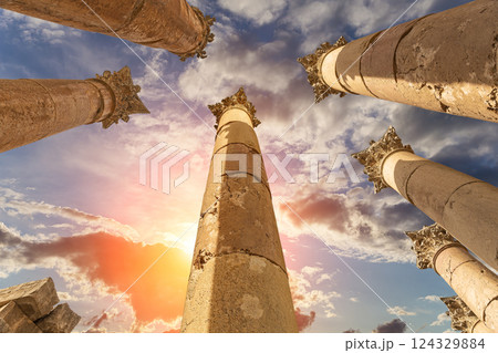 Roman Columns in the Jordanian city of Jerash (Gerasa of Antiquity), capital and largest city of Jerash Governorate, Jordan. Against the background of a beautiful sky with clouds 124329884